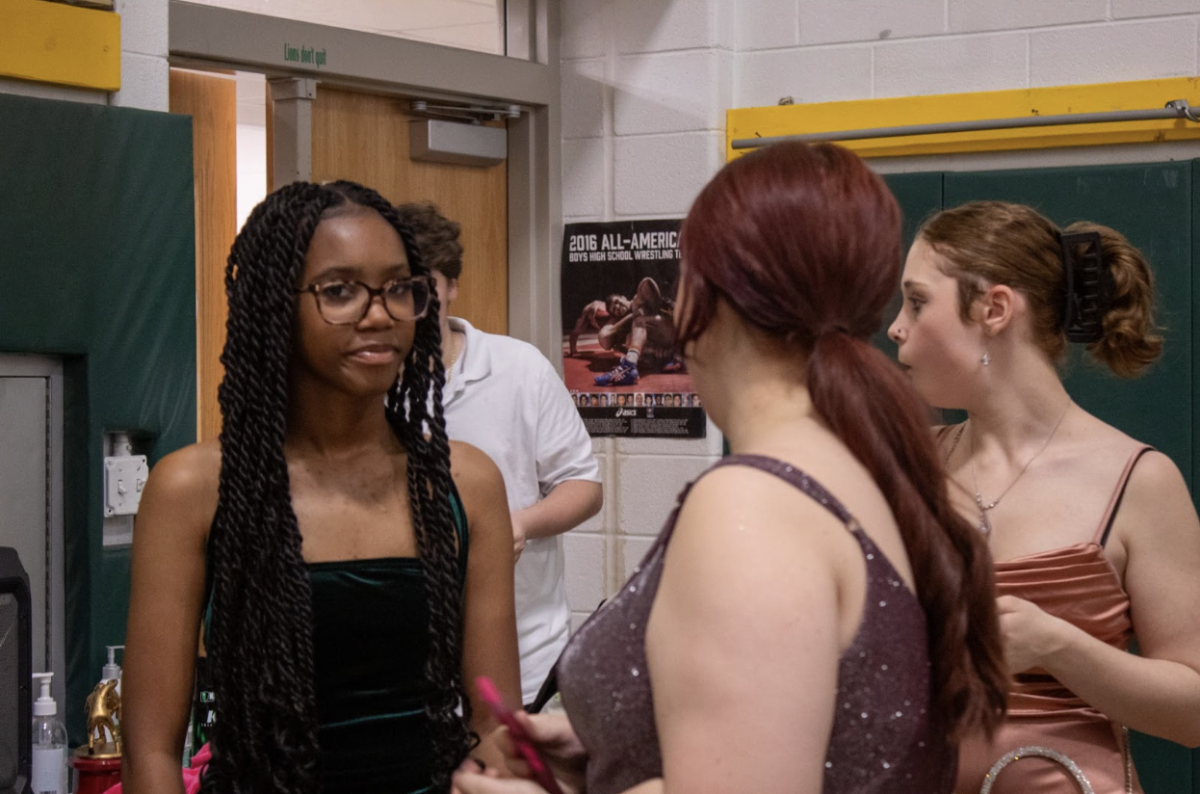 Buddy club members gather by the food tables.